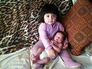 Julie Adrianna Marie joined the competition — help win amazing prizes! baby, baby_toddler_clothing, cheek, child, comfort, eye, finger, foot, fun, happy, lap, linens, pattern, person, sitting, skin, textile, thumb, toddler, wood