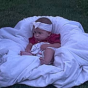 Ahvi joined the competition — help win amazing prizes! baby, bedding, blanket, candid, child, cozy, face, grass, hands, headband, infant, legs, outdoor, portrait, red_shirt, sitting, sleepy, soft_focus, vintage, white_blanket