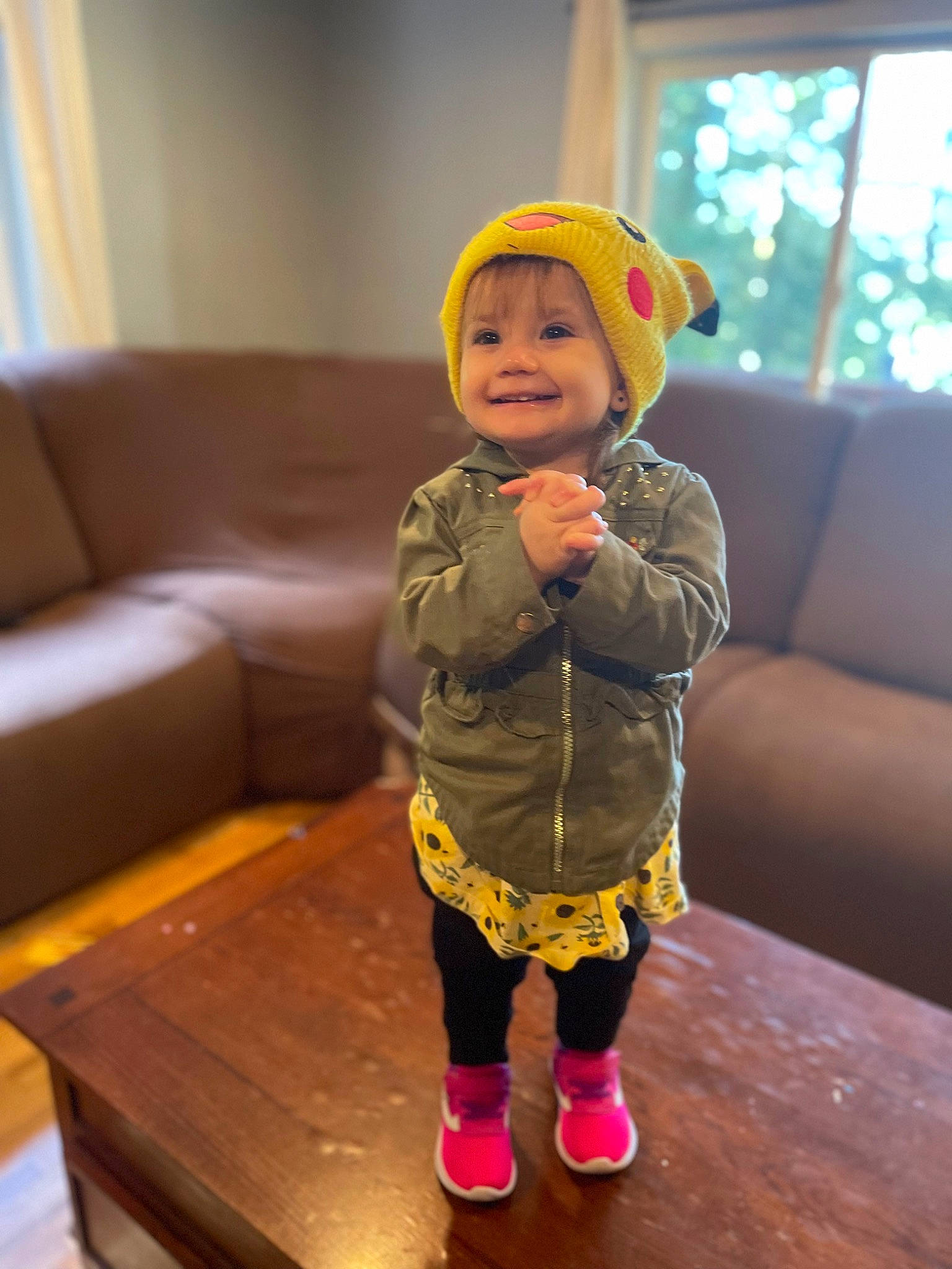 Adrian joined the competition — help win amazing prizes! baby_toddler_clothing, cap, child, comfort, couch, face, facial_expression, floor, flooring, fun, happy, head, joy, outerwear, person, skin, sleeve, smile, standing, toddler