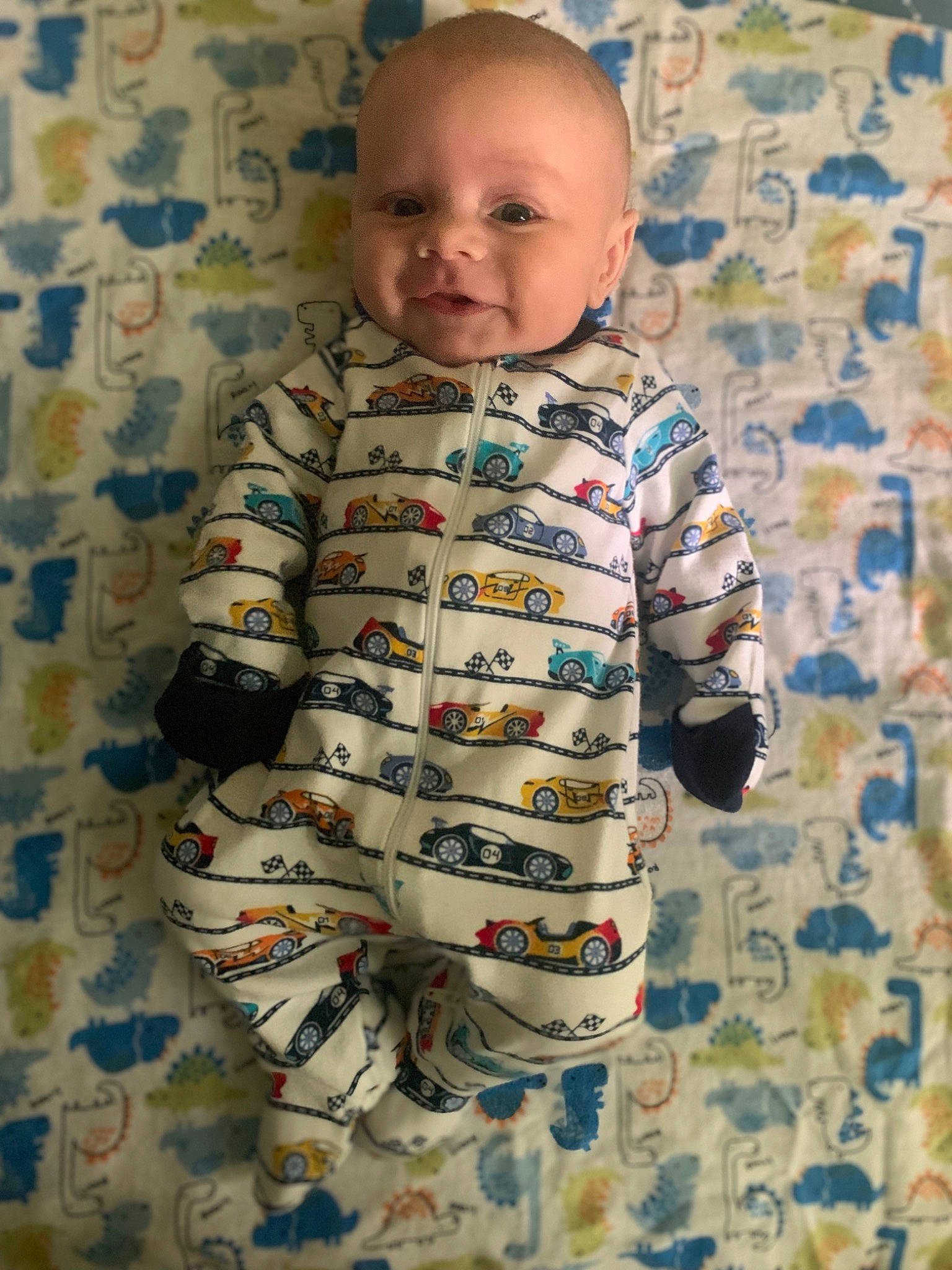 Malakhai joined the competition — help win amazing prizes! baby, baby_toddler_clothing, child, comfort, electric_blue, eye, face, flooring, happy, head, linens, pattern, person, room, sitting, skin, sleeve, smile, t_shirt, toddler