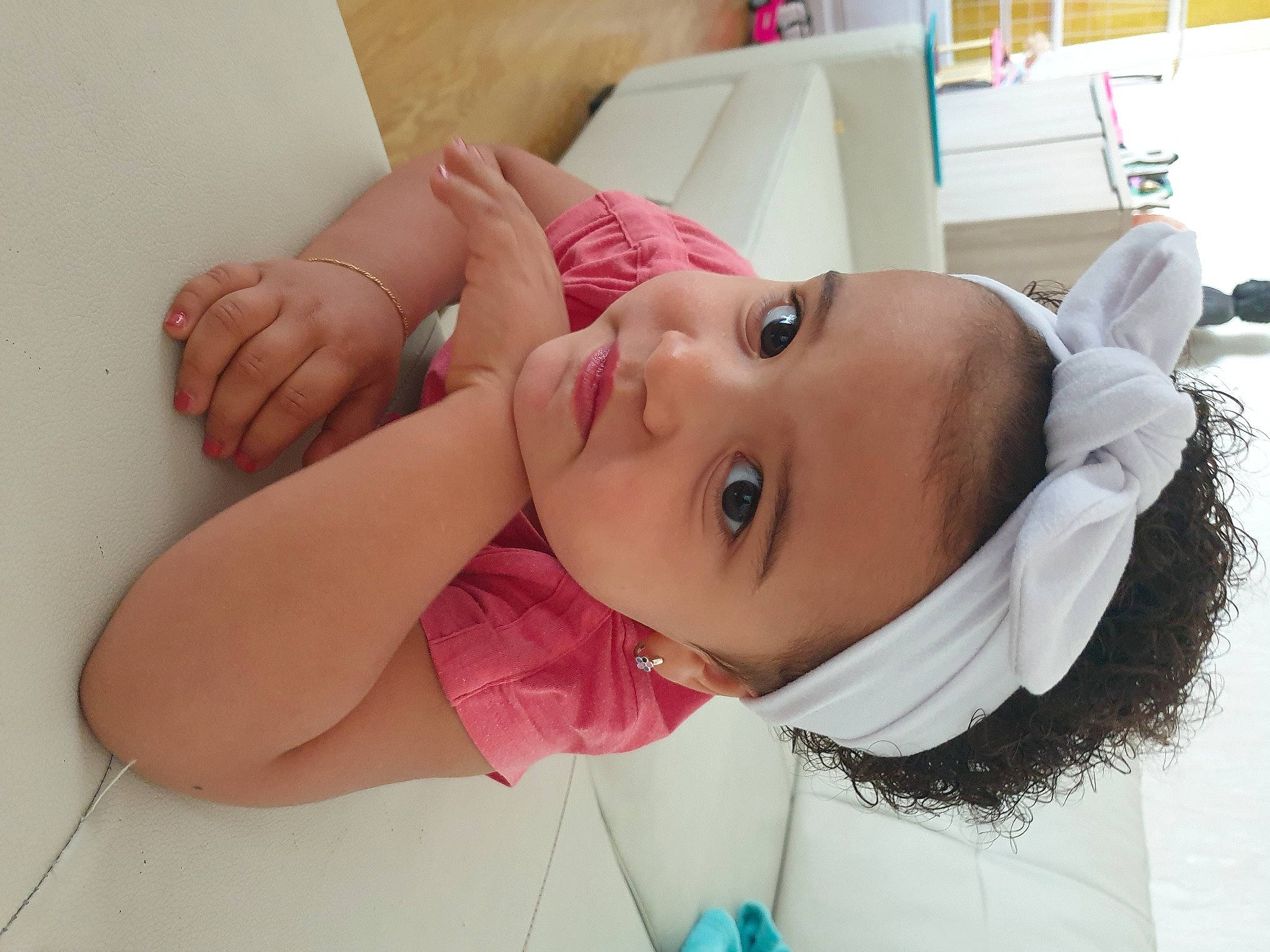 Angeline participe au concours pour gagner de l'argent avec cette photo : baby, baby_toddler_clothing, cheek, child, comfort, ear, eyebrow, eyelash, face, fun, gesture, happy, hat, headwear, lip, mouth, neck, nose, person, pink