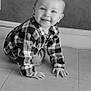 Lyam a rejoint le concours — aidez-le/la à gagner de superbes lots ! baby, child, crawling, plaid_shirt, smiling, indoor, floor, tile, face, happy, young_child, head, person, candid, portrait, cute, eyes, long_sleeve, wall, light