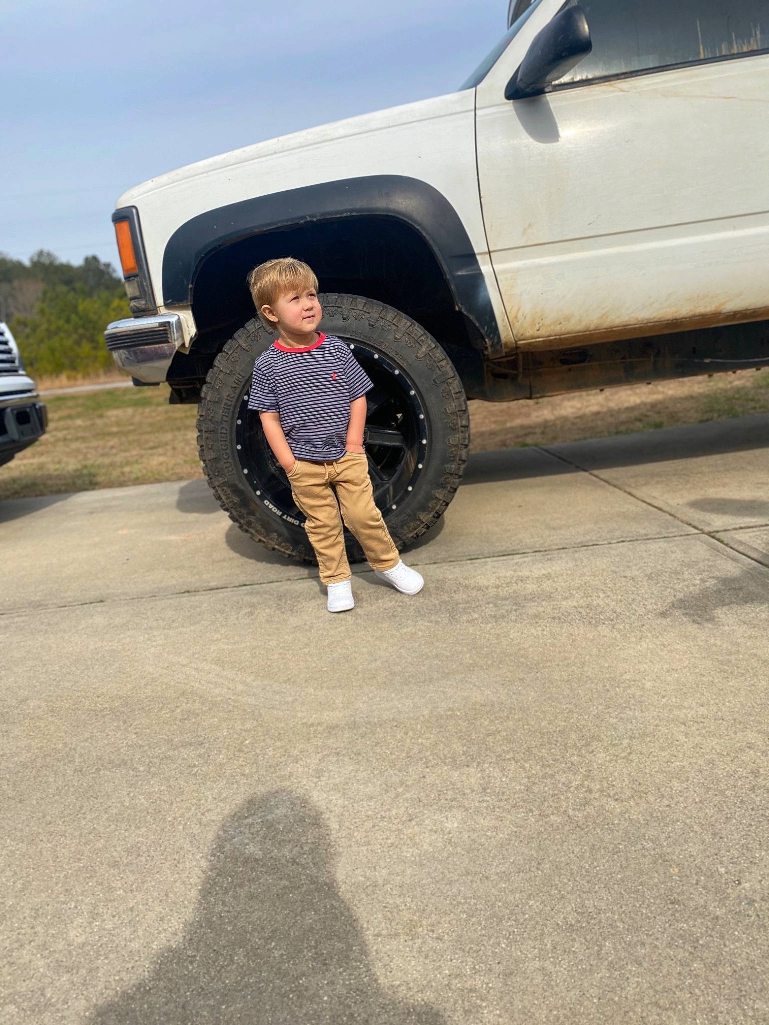 Weston is registered to the contest to win money with this photo: alloy_wheel, auto_part, automotive_design, automotive_exterior, automotive_tire, automotive_wheel_system, automotive_window_part, bumper, bumper_part, fender, grille, hood, land_vehicle, person, rim, sport_utility_vehicle, synthetic_rubber, tire, tread, vehicle_door