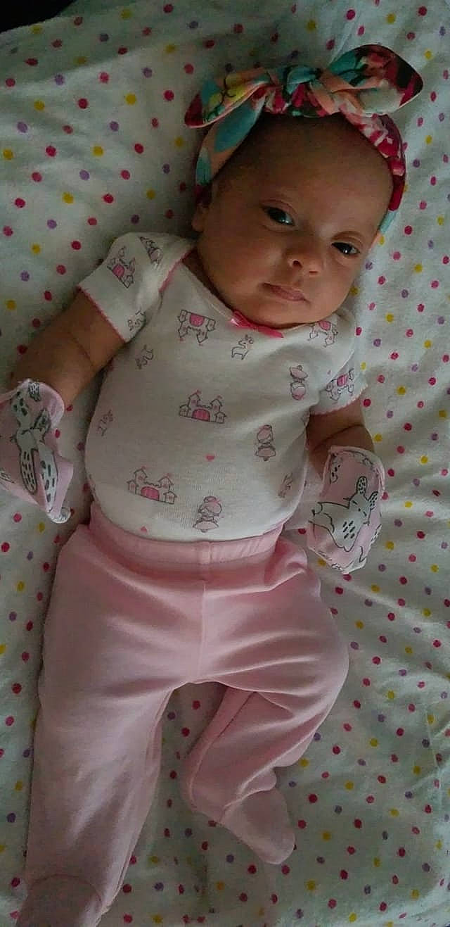 Nola is registered to the contest to win money with this photo: baby_products, child, day, girl, infant, iris, person, pink, product, skin, textile, toddler