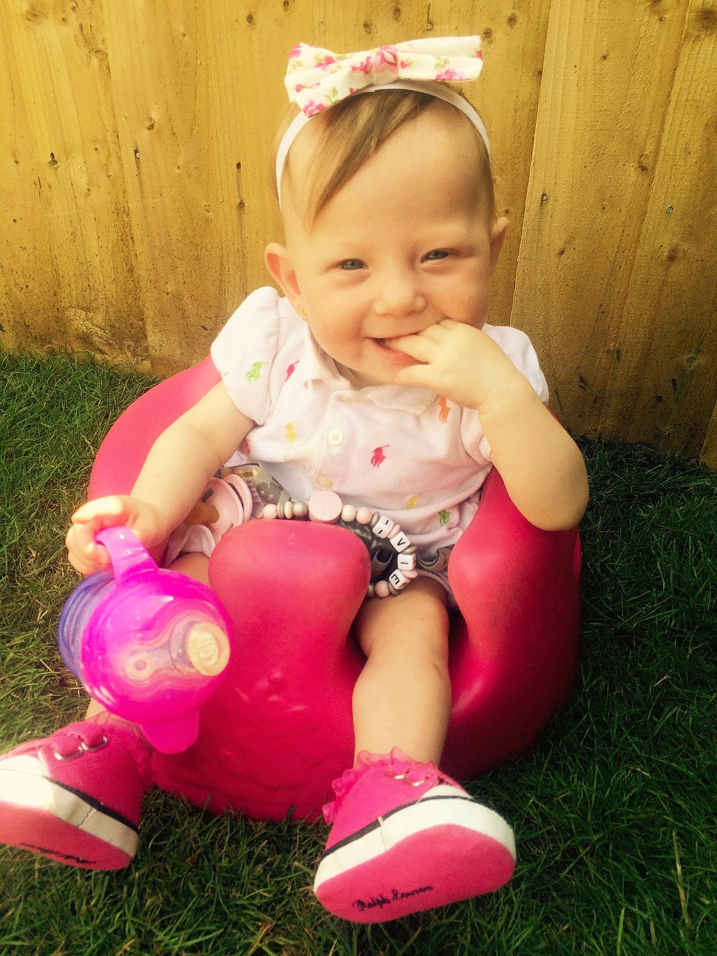 Ivie is registered to the contest to win money with this photo: child, human_positions, infant, joy, person, pink, play, sitting, skin, toddler