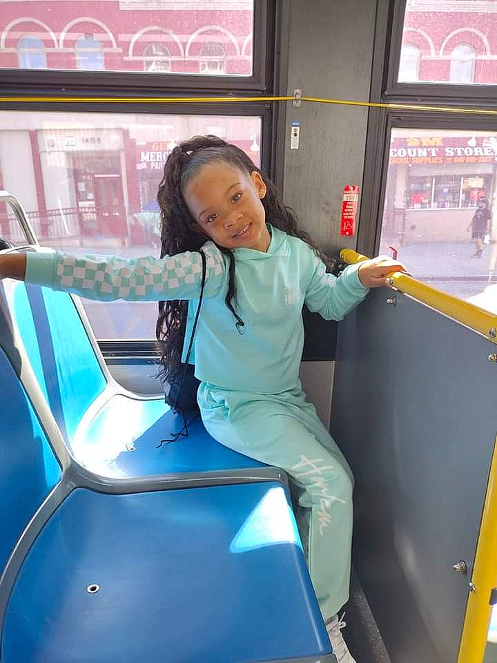 Lenox is registered to the contest to win money with this photo: automotive_design, automotive_exterior, automotive_window_part, electric_blue, fun, hood, job, joy, leisure, machine, mode_of_transport, motor_vehicle, person, public_transport, recreation, smile, t_shirt, thigh, travel, vehicle