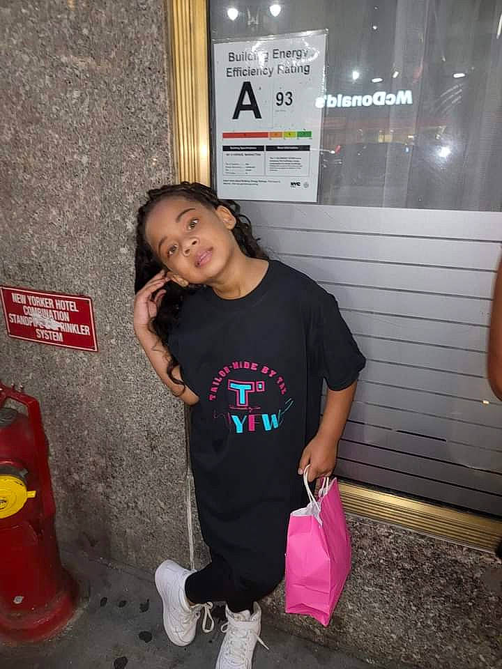 Lenox is registered to the contest to win money with this photo: child, concrete, flooring, fun, hairstyle, happy, joint, leisure, magenta, person, play, recreation, room, sleeve, snapshot, standing, t_shirt