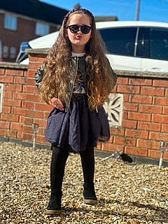 Alexandra joined the competition — help win amazing prizes! blazer, blond, brown_hair, denim, electric_blue, eyewear, fashion_design, goggles, human_leg, knee, leather_jacket, long_hair, pattern, person, plaid, sleeve, sunglasses, tartan, thigh, vision_care