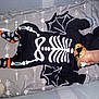 baby, sleeping, costume, skeleton, bat_wings, pacifier, crib, blanket, sock, skull_pattern, infant, cute, black_clothing, head, face, nap, child, toddler, patterned, indoors