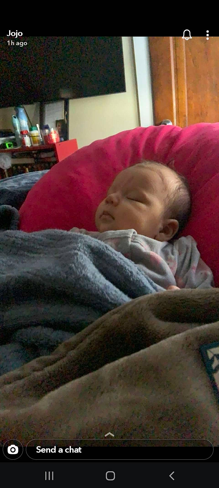 Clementine is registered to the contest to win money with this photo: baby, baby_products, bedtime, cheek, child, comfort, couch, lamp, linens, mammal, nap, nose, person, picture_frame, room, sitting, skin, sleep, television, toddler