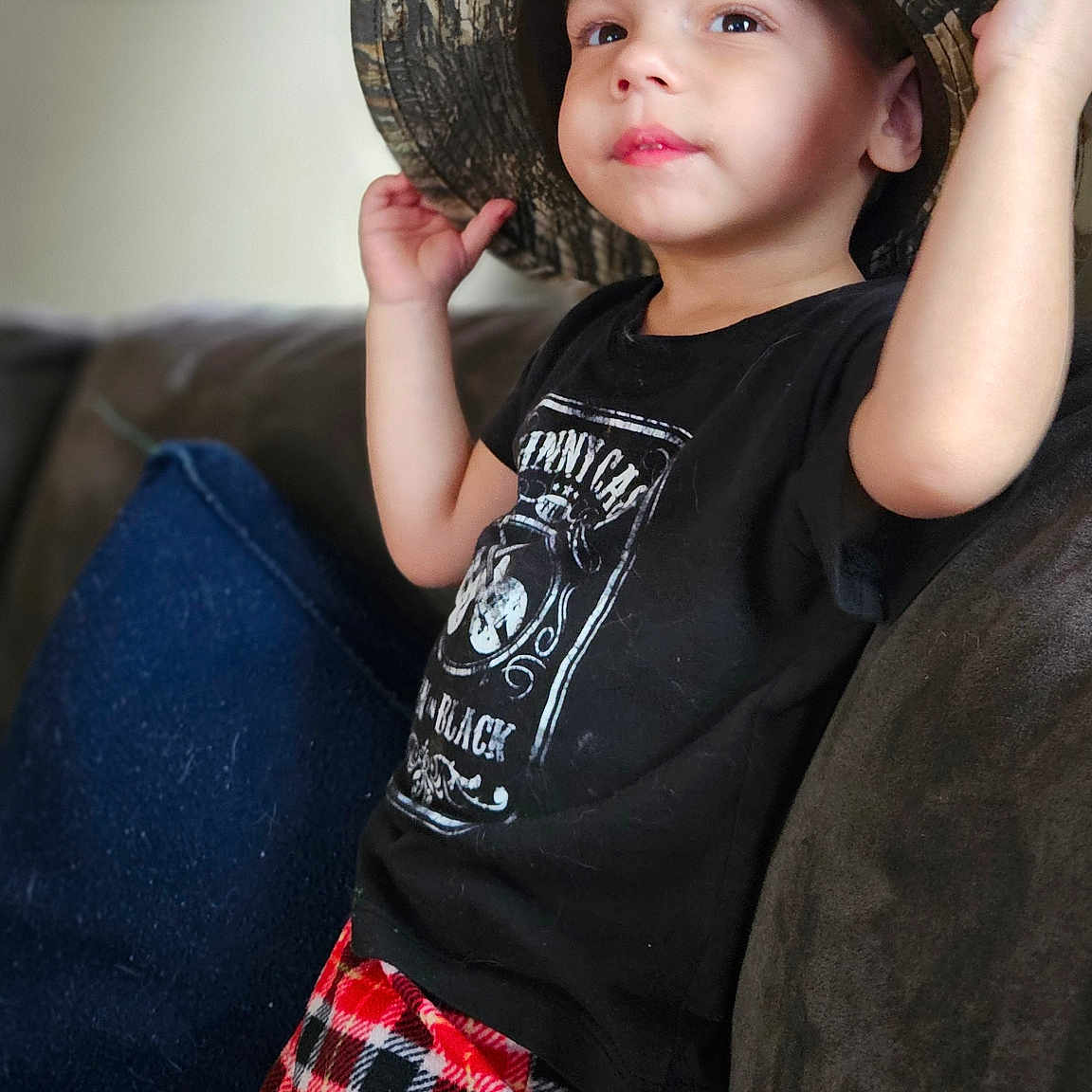 Axton joined the competition — help win amazing prizes! bodypart, boy, cap, child, clothing, couch, face, finger, furniture, hand, hat, head, homedecor, male, pants, person, photography, portrait, sunhat, t_shirt
