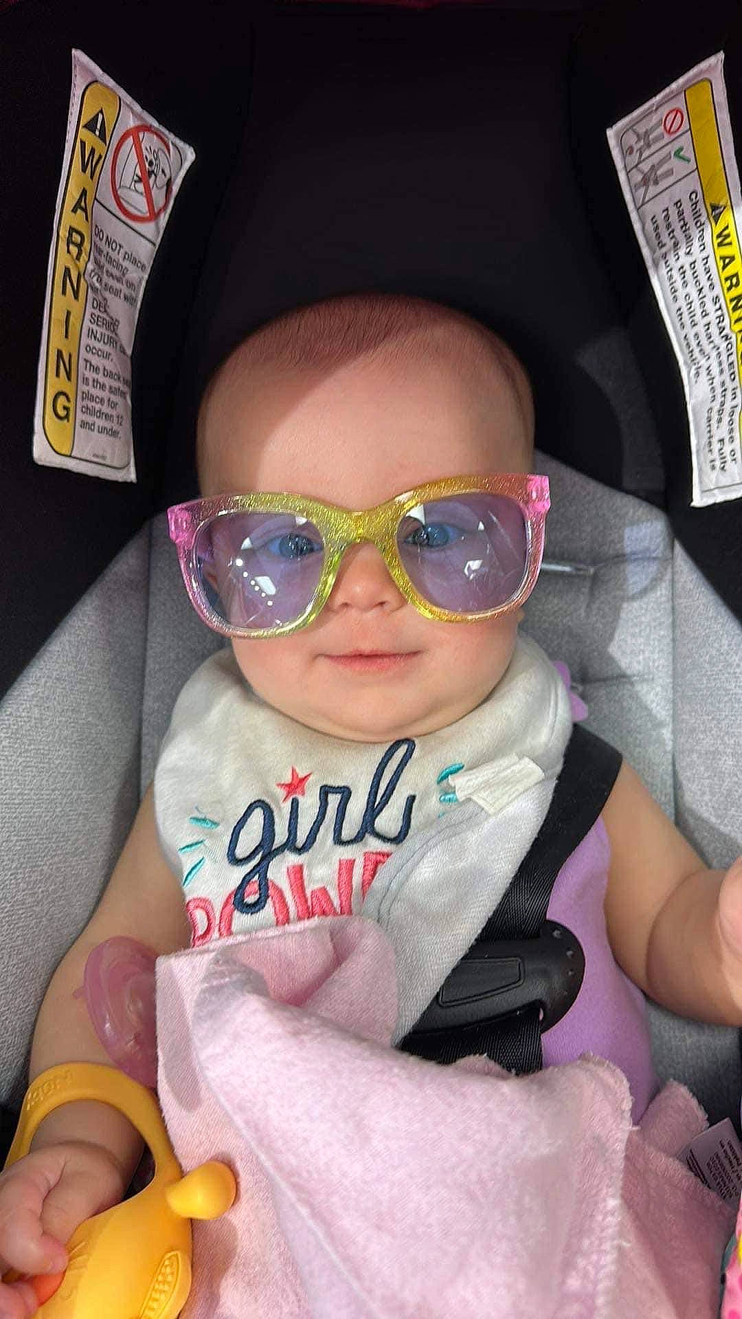Avery is registered to the contest to win money with this photo: baby, baby_toddler_clothing, cap, car_seat, cheek, cool, eyewear, fashion_accessory, finger, fun, glasses, goggles, hand, nail, person, personal_protective_equipment, pink, sunglasses, thumb, toddler