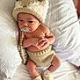 baby, infant, newborn, pacifier, beaded_clip, knit_hat, hat, knitted_bloomers, booties, bed, pillow, blanket, portrait, hands, legs, skin, cute, cozy, indoors, soft_focus