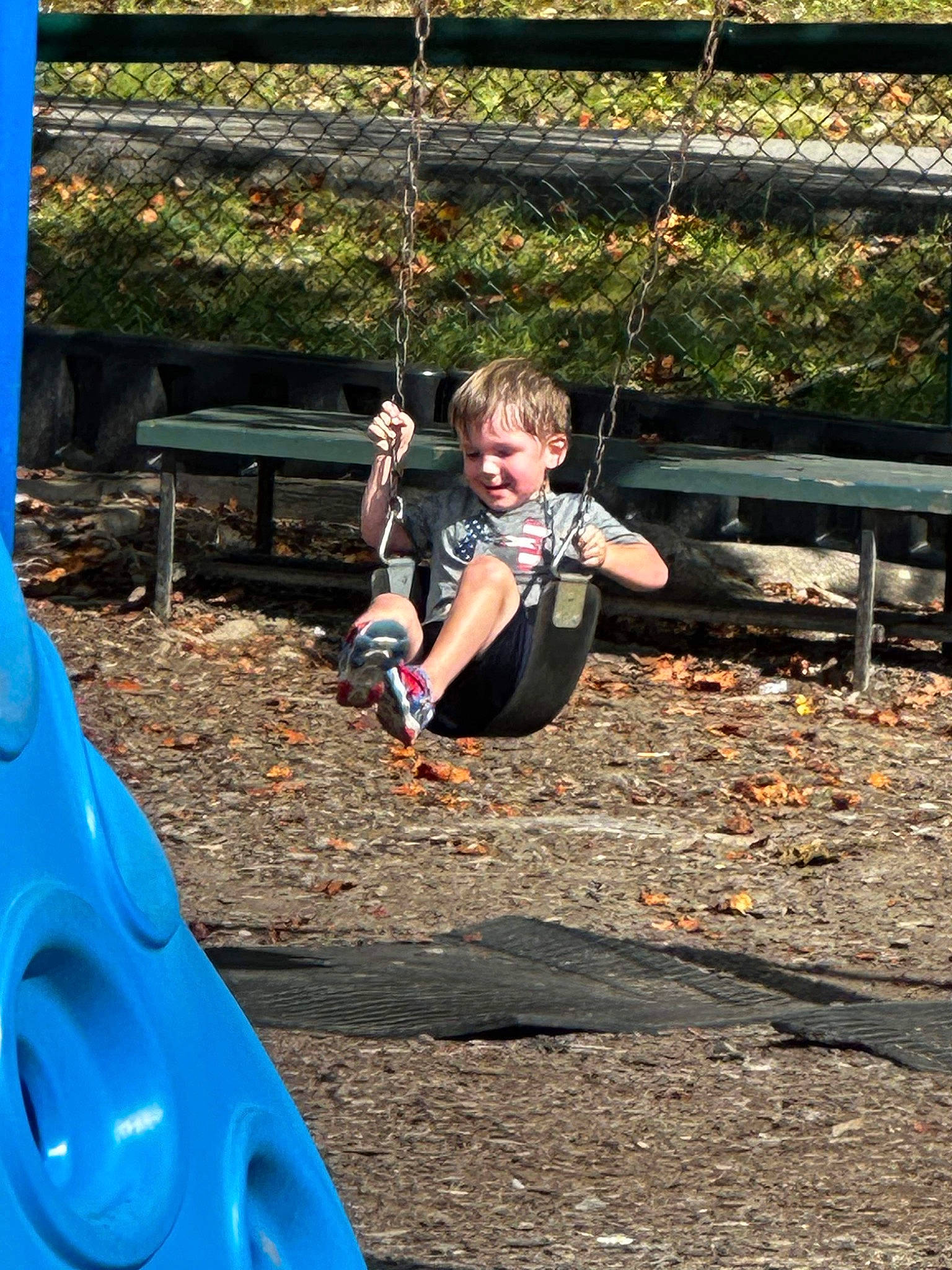 Carsen joined the competition — help win amazing prizes! chute, city, electric_blue, fun, grass, leisure, outdoor_play_equipment, outdoor_recreation, people_in_nature, person, play, playground, playground_slide, recreation, shorts, soil, spring, swing, toddler, tree