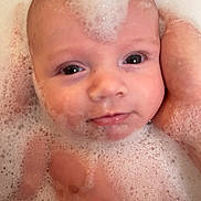 Aylann participe au concours pour gagner de l'argent avec cette photo : baby, infant, bathtub, bubbles, foam, face, eyes, hand, adult_hand, bath, closeup, portrait, skin, cheeks, wet, smile, gaze, water, cute, parenting