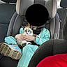Nila joined the competition — help win amazing prizes! child, car_seat, kitten, cat, animal, indoor, child_clothing, car_interior, seatbelt, window, tree, outdoor_view, shoe, person, pet, cute, holding, blue_shoes, sitting, daylight