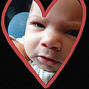 Raphael joined the competition — help win amazing prizes! baby, face, close_up, heart_shape, expression, infant, skin, portrait, curious, cute, black_background, red_heart, child, young, head, eyes, nose, mouth, clothing, texture