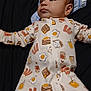 Raphael is registered to the contest to win money with this photo: baby, bacon, blanket, breakfast_pattern, child, clothing, comfort, cute, eggs, fabric, indoor, infant, laying_down, milk_carton, onesie, pancakes, portrait, sleepwear, soft, young