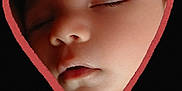 Raphael joined the competition — help win amazing prizes! baby, black_background, calm, child, closeup, cute, eyelashes, face, head, heart_shape, infant, love, mouth, nose, peaceful, portrait, skin, sleeping, soft_light, tender