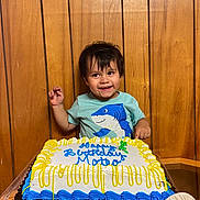 Mateo joined the competition — help win amazing prizes! birthdaycake, bodypart, cake, clothing, cream, dessert, face, finger, food, hand, head, icecream, icing, people, person, photography, portrait, sitting, sweets, t_shirt