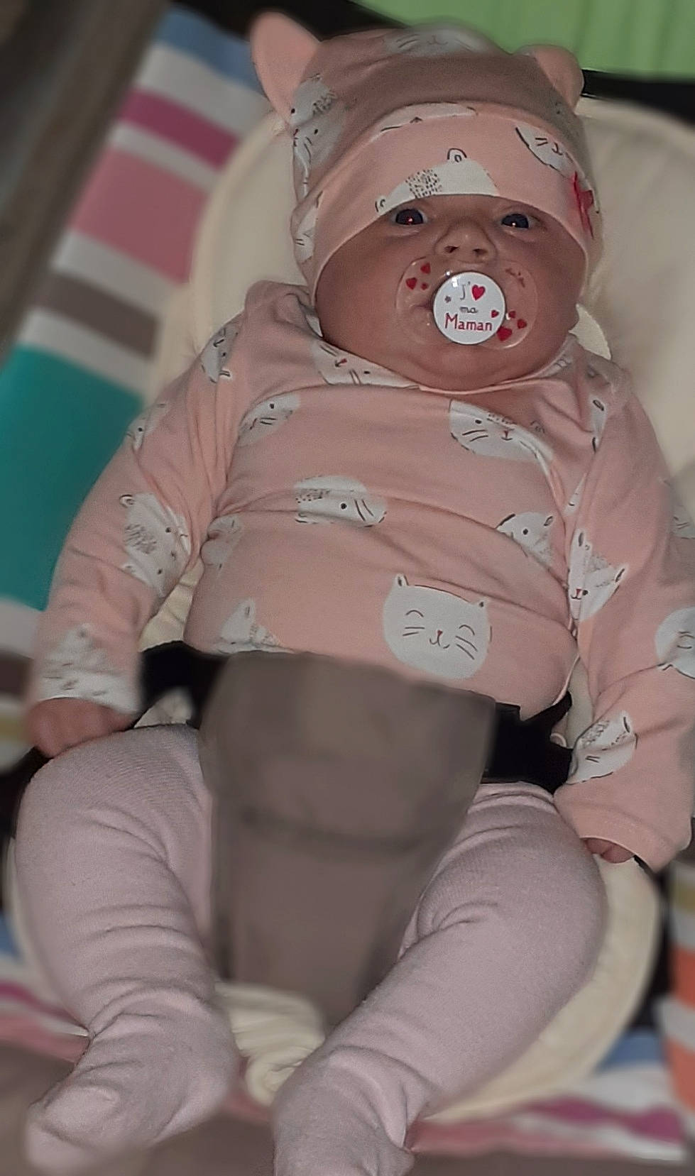 Lexie participe au concours pour gagner de l'argent avec cette photo : baby, baby_products, baby_sleeping, baby_toddler_clothing, carmine, child, comfort, hat, headgear, human_body, human_leg, knee, mouth, personal_protective_equipment, pink, sitting, skin, sleeve, thigh, toddler