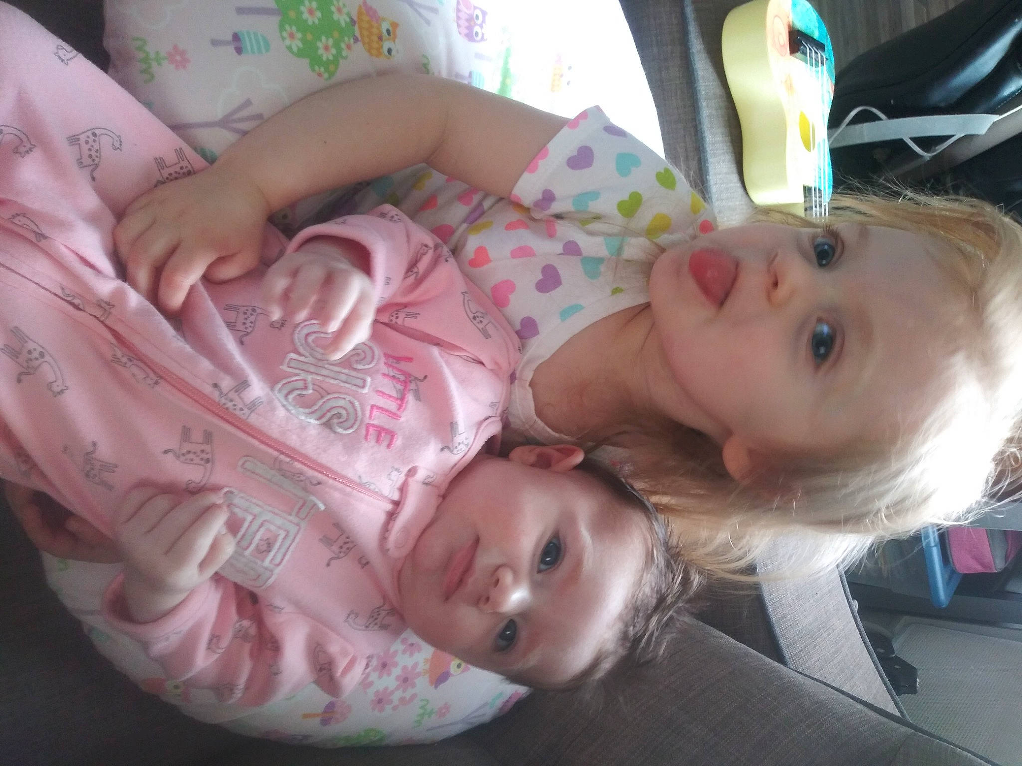 Adaline is registered to the contest to win money with this photo: baby, baby_toddler_clothing, blond, cheek, child, comfort, eye, eyelash, fun, happy, iris, lip, mouth, nose, person, room, skin, smile, toddler, tree