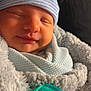 Sawyer is registered to the contest to win money with this photo: newborn, baby, sleeping, hat, striped_hat, blanket, swaddled, pacifier, soft_texture, closeup, infant, cozy, cute, face, peaceful, resting, wrapped, child, warm_light, portrait