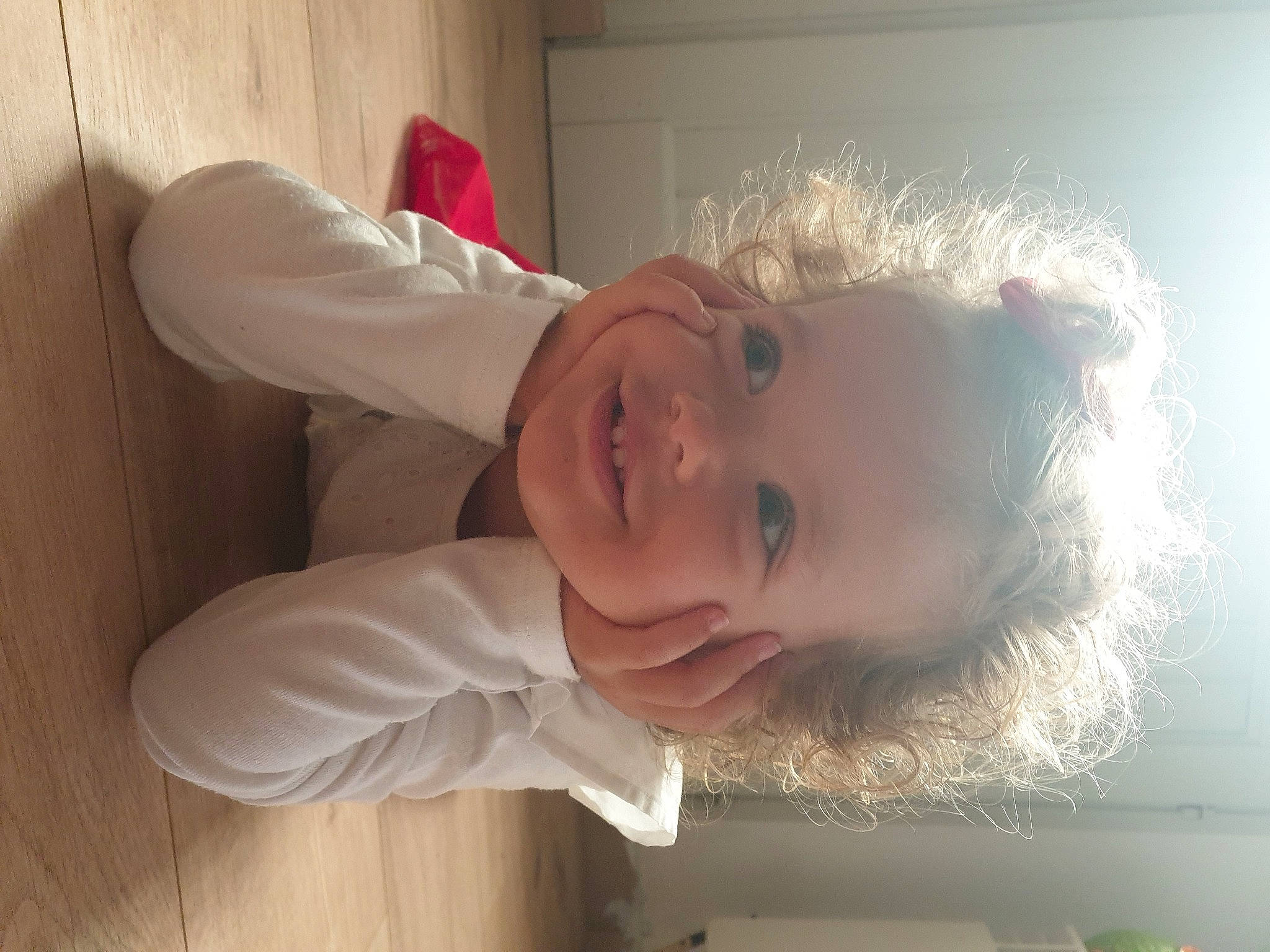 Maëlle participe au concours pour gagner de l'argent avec cette photo : baby, baby_toddler_clothing, cheek, child, chin, dress, eye, eyebrow, flooring, fun, gesture, happy, head, joy, lip, mouth, nose, person, skin, sleeve