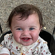 Amara is registered to the contest to win money with this photo: baby, child, smile, face, swing, outdoor, onesie, animal_print, hand, happy, young_child, curly_hair, cute, playground, infant, joy, cheeks, person, portrait, seat