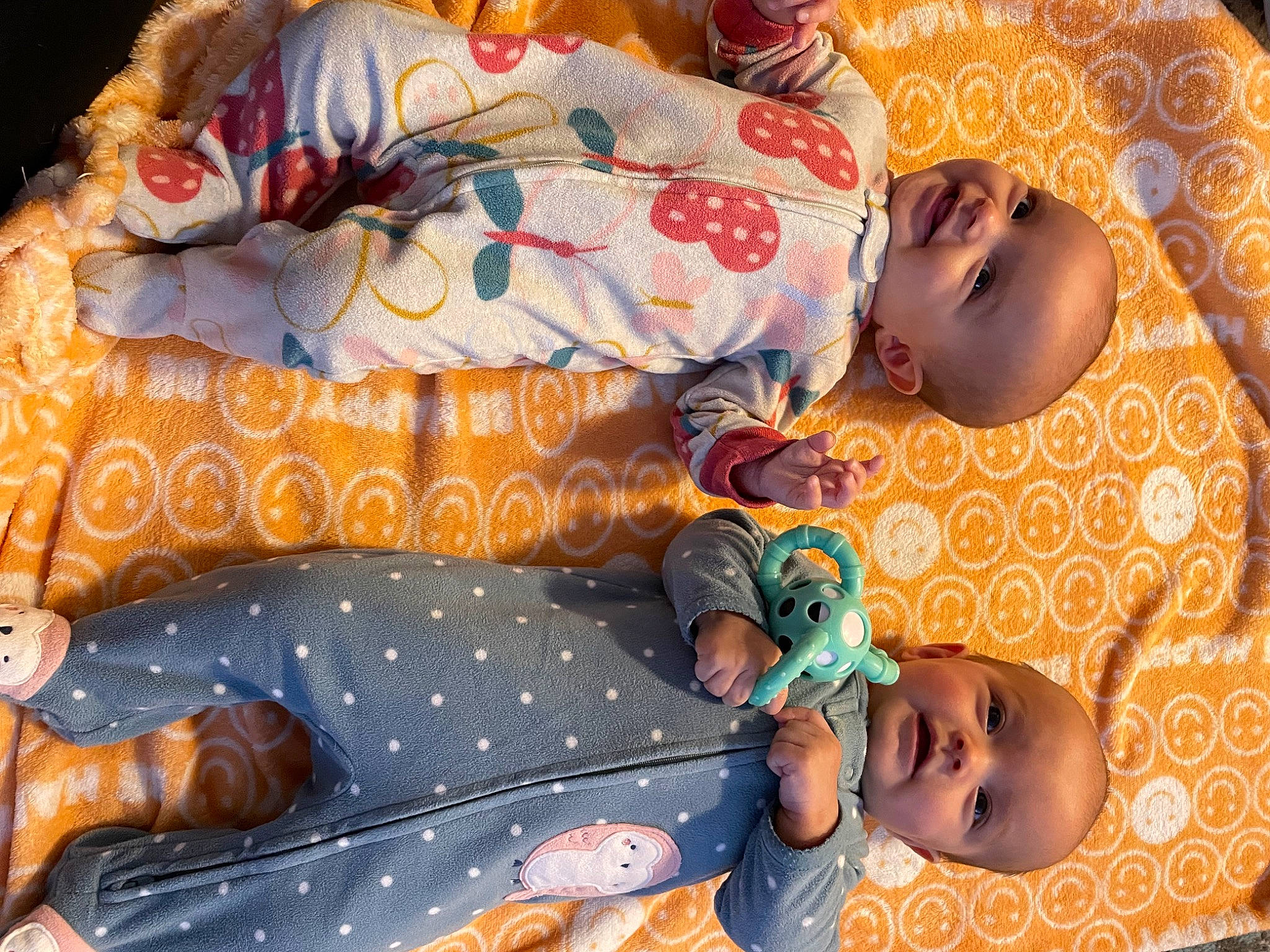 Kaidyn is registered to the contest to win money with this photo: arm, baby, baby_products, baby_sleeping, baby_toddler_clothing, bedding, bedtime, child, comfort, couch, happy, linens, nap, orange, pattern, person, product, room, sleep, textile