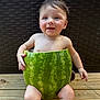 baby, child, watermelon, fruit, smiling, outdoor, wooden_deck, summer, cute, playful, skin, happy, sitting, nature, green, fruit_shell, infant, barefoot, daylight, young