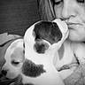 Lilly And Tilly is registered to the contest to win money with this photo: puppy, dog, person, face, black_and_white, close_up, cute, affection, love, animal, pet, snout, cuddle, companion, young, fur, nose, indoor, human, touch