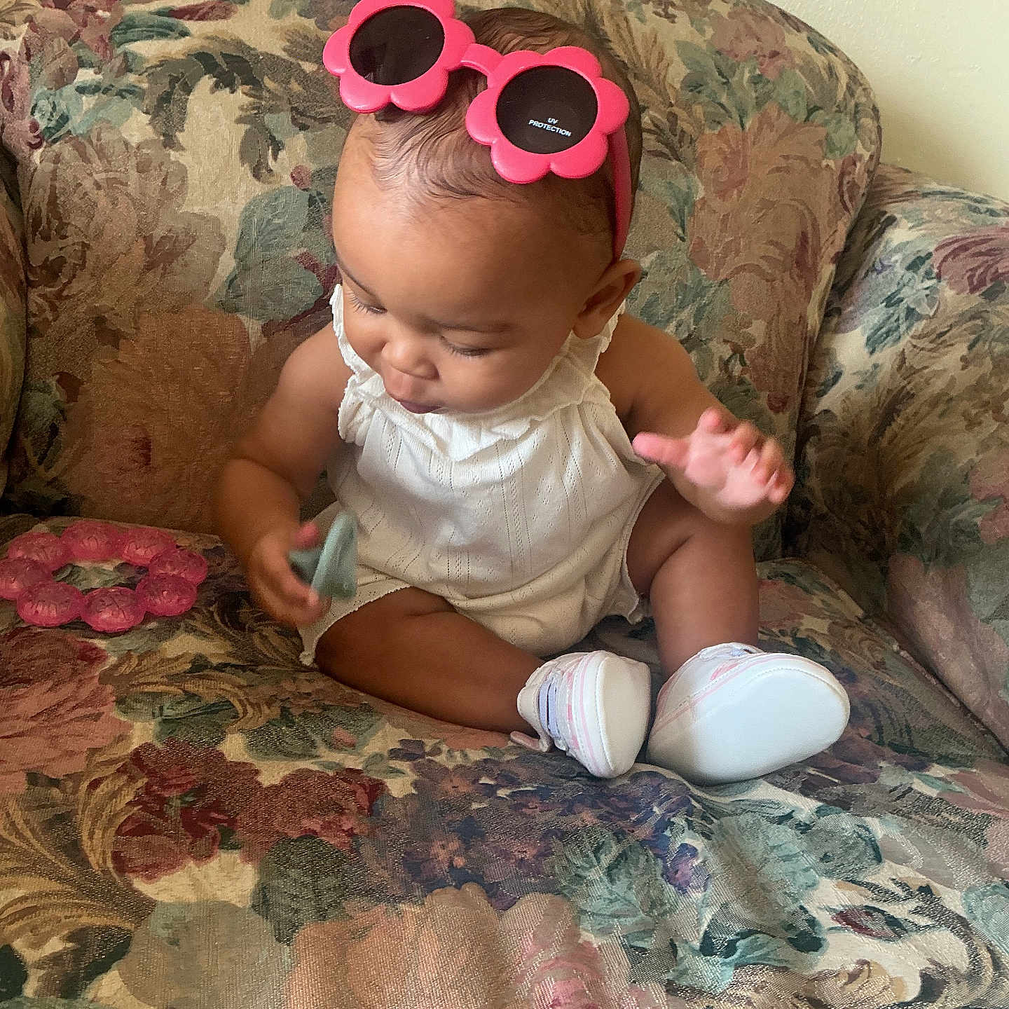 Eevee joined the competition — help win amazing prizes! baby, casual, child, couch, curious, cute, floral_pattern, flower_shaped, furniture, headband, homedecor, indoor, infant, pink, portrait, sitting, small_object, sunglasses, white_outfit, white_shoes