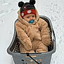 Mael participe au concours pour gagner de l'argent avec cette photo : baby, child, snow, winter_clothing, hat, pacifier, laundry_basket, outdoor, cold_weather, fuzzy_suit, plastic_basket, blue_eyes, infant, cute, winter, snowy_ground, pom_pom_hat, seated, face, bundle_up