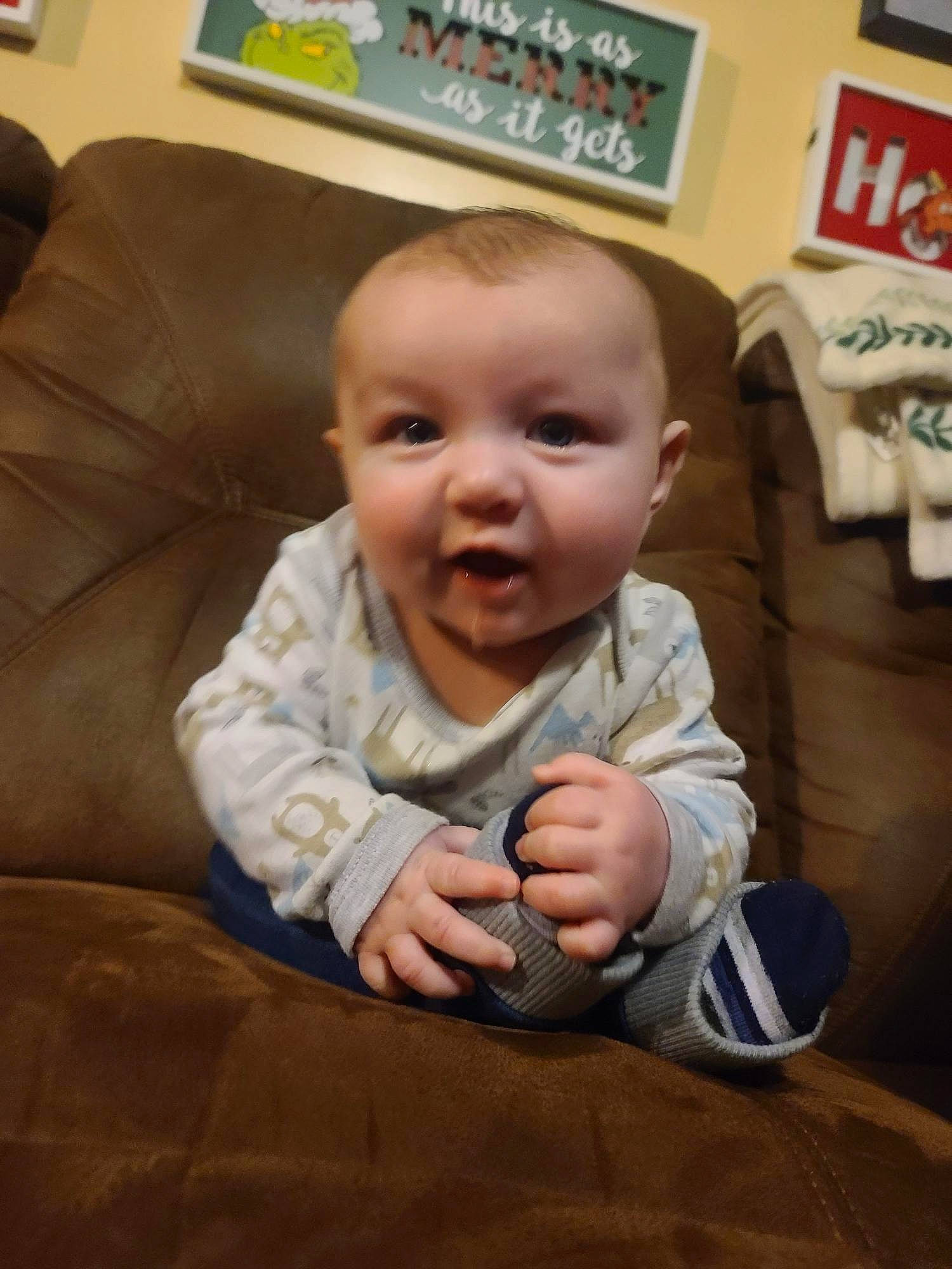 Brandon joined the competition — help win amazing prizes! baby, baby_toddler_clothing, cheek, child, comfort, couch, finger, flooring, gesture, hand, happy, human_body, mouth, nose, person, picture_frame, skin, smile, thumb, toddler
