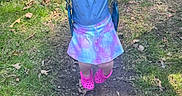 Kinsley is registered to the contest to win money with this photo: backyard, blue_shirt, bunny_ears, casual_clothing, child, daylight, fun, grass, happy, leaves, outdoor, pastel_skirt, person, pink_shoes, play, smiling, spring, swing, wooden_fence, young_kid