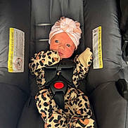Mckaylynn joined the competition — help win amazing prizes! baby, infant, car_seat, leopard_print, onesie, hat, turban, stripes, buckle, black, pink, clothing, child, newborn, seatbelt, safety, cute, portrait, indoor, person