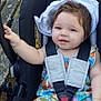 baby, child, stroller, outdoor, harness, colorful_clothing, smile, happy, face, legs, hand, grass, wooden_bench, infant, seat, safety, cute, young, person, summer