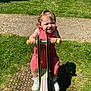 Paolina participe au concours pour gagner de l'argent avec cette photo : toddler, child, red_dress, playground, seesaw, grass, sunlight, shoes, happy, smiling, outdoor, play, summer, park, fun, young_child, person, daylight, grass_field, recreation