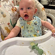 Hugo joined the competition — help win amazing prizes! baby, high_chair, bib, food, messy, kitchen, infant, feeding, expression, face, mouth_open, clothing, plastic, utensil, toy, happy, person, child, indoor, seat