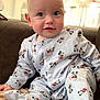 Hugo is registered to the contest to win money with this photo: baby, child, infant, mickey_mouse, pajamas, blue_eyes, couch, indoor, cute, smiling, soft_lighting, comfortable, portrait, clothing, sitting, young_child, human, face, head, happy