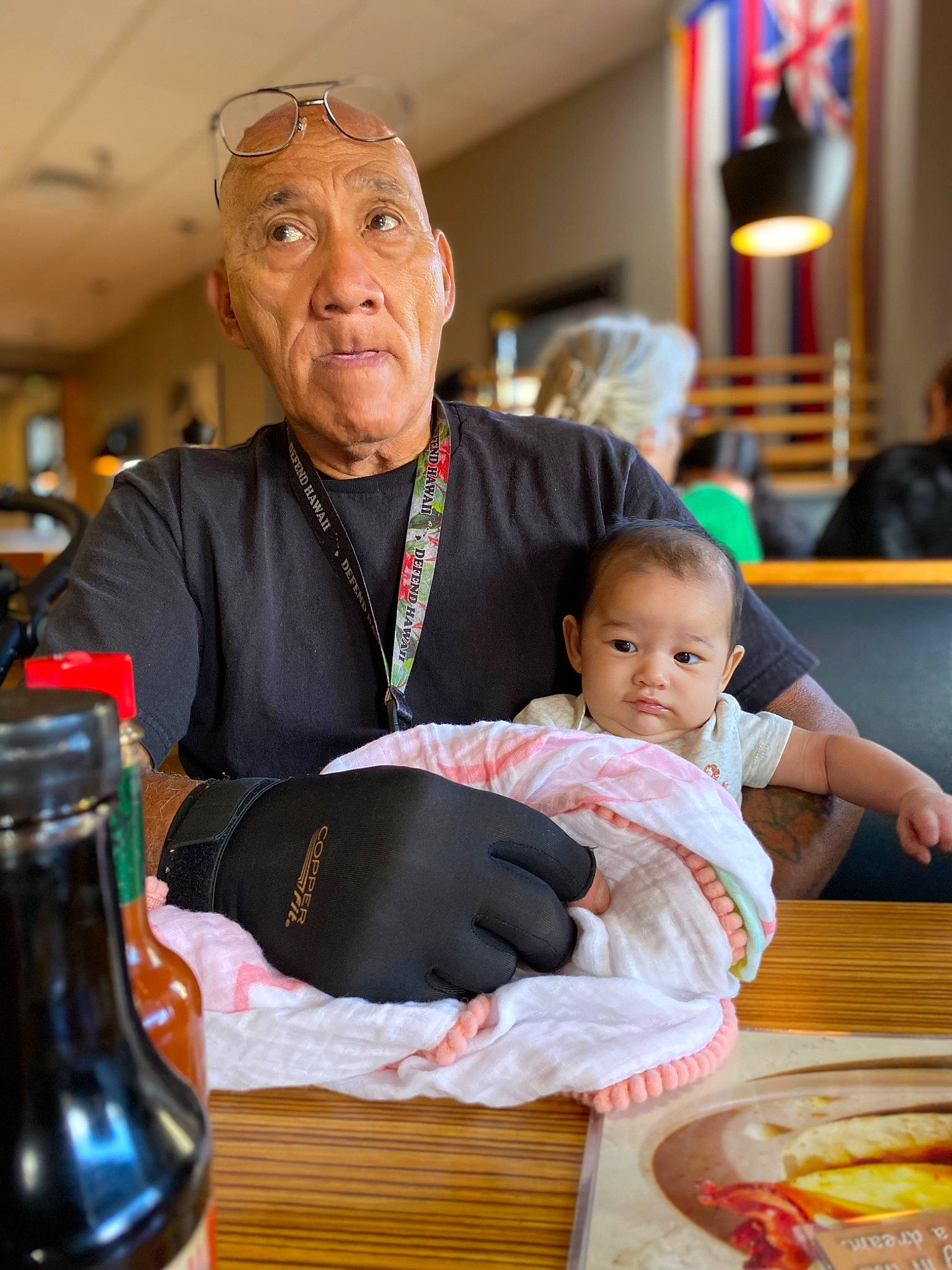 Joanna is registered to the contest to win money with this photo: baby, bottle, chair, child, comfort_food, drink, drinkware, event, fun, glass_bottle, happy, person, red, room, service, sitting, skin, tableware, tie, toddler