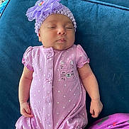 Jazmín joined the competition — help win amazing prizes! baby, infant, sleeping, purple_clothing, polka_dot, hat, flower, crochet, cute, couch, blue_fabric, relaxing, indoor, child, small_hand, pajamas, pattern, soft_texture, peaceful, portrait