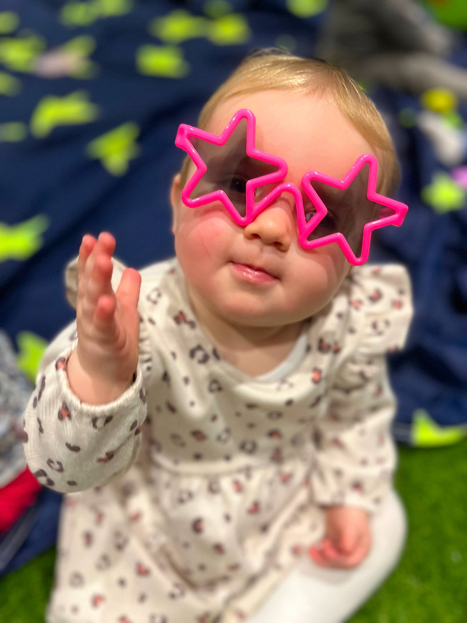 Darcie joined the competition — help win amazing prizes! baby, baby_toddler_clothing, child, cool, event, eyewear, fun, gesture, grass, happy, leisure, pattern, people_in_nature, person, personal_protective_equipment, pink, sleeve, summer, thumb, toddler
