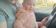 Willow is registered to the contest to win money with this photo: accessories, baby, beard, belt, car, clothing, cushion, driving, face, head, homedecor, newborn, pants, person, photography, portrait, sitting, t_shirt, transportation, vehicle
