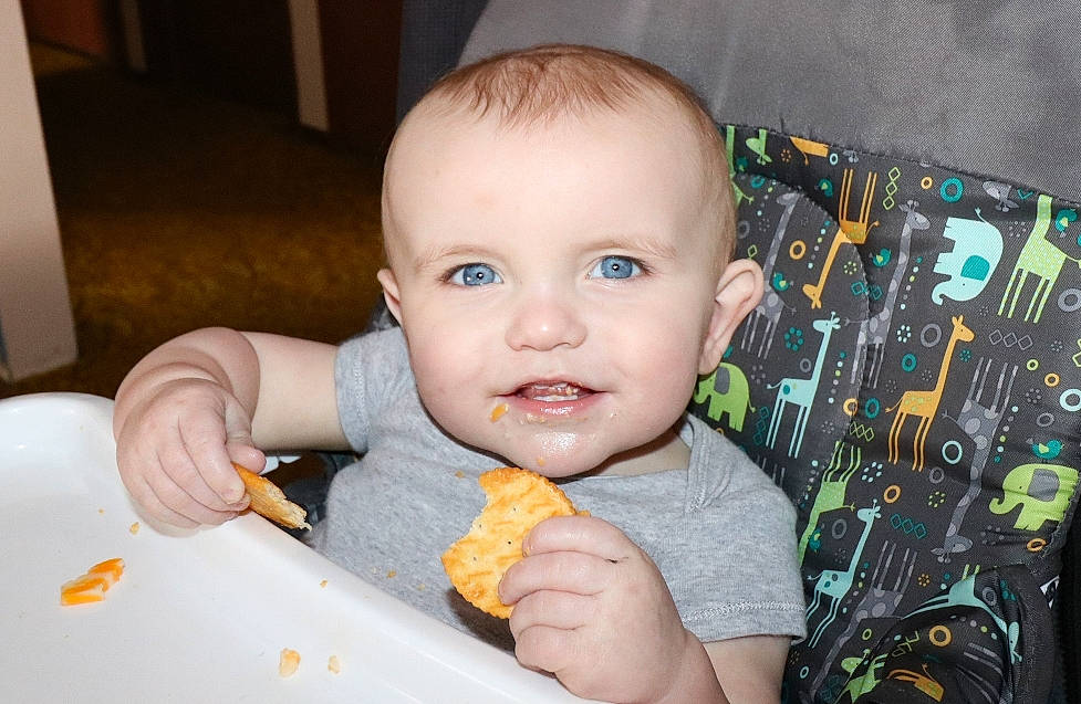 Easton is registered to the contest to win money with this photo: baby, baby_food, child, comfort_food, cuisine, eating, finger, food, person, smile, toddler
