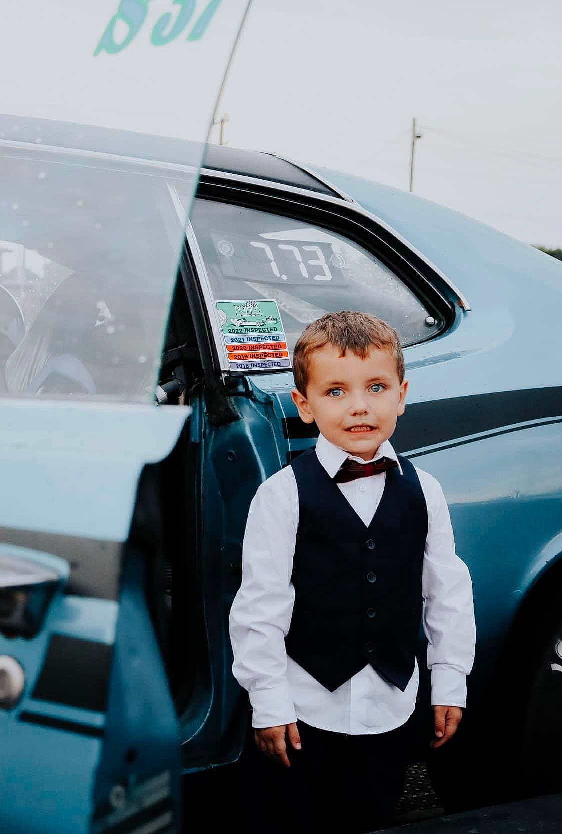 Easton is registered to the contest to win money with this photo: auto_part, automotive_design, automotive_exterior, automotive_lighting, automotive_window_part, bumper, car, electric_blue, family_car, formal_wear, glass, hood, luxury_vehicle, mid_size_car, motor_vehicle, person, personal_luxury_car, tie, vehicle, vehicle_door