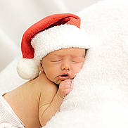 Arlo is registered to the contest to win money with this photo: baby, newborn, sleeping, santa_hat, holiday, christmas, cozy, blanket, cute, infant, soft, warm, resting, child, portrait, adorable, holiday_theme, white, red, peaceful