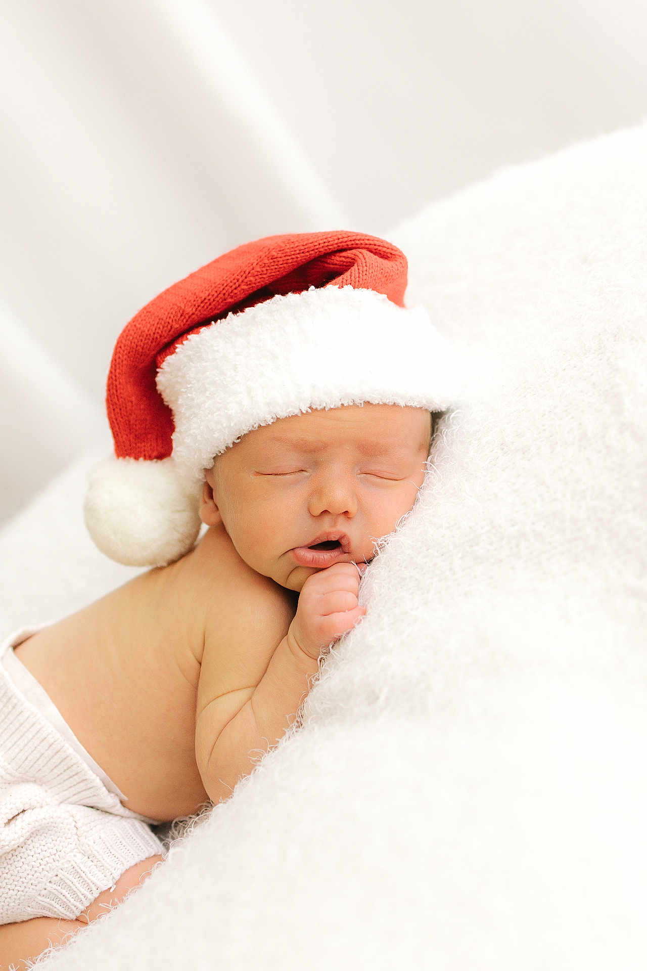 Arlo is registered to the contest to win money with this photo: baby, newborn, sleeping, santa_hat, holiday, christmas, cozy, blanket, cute, infant, soft, warm, resting, child, portrait, adorable, holiday_theme, white, red, peaceful