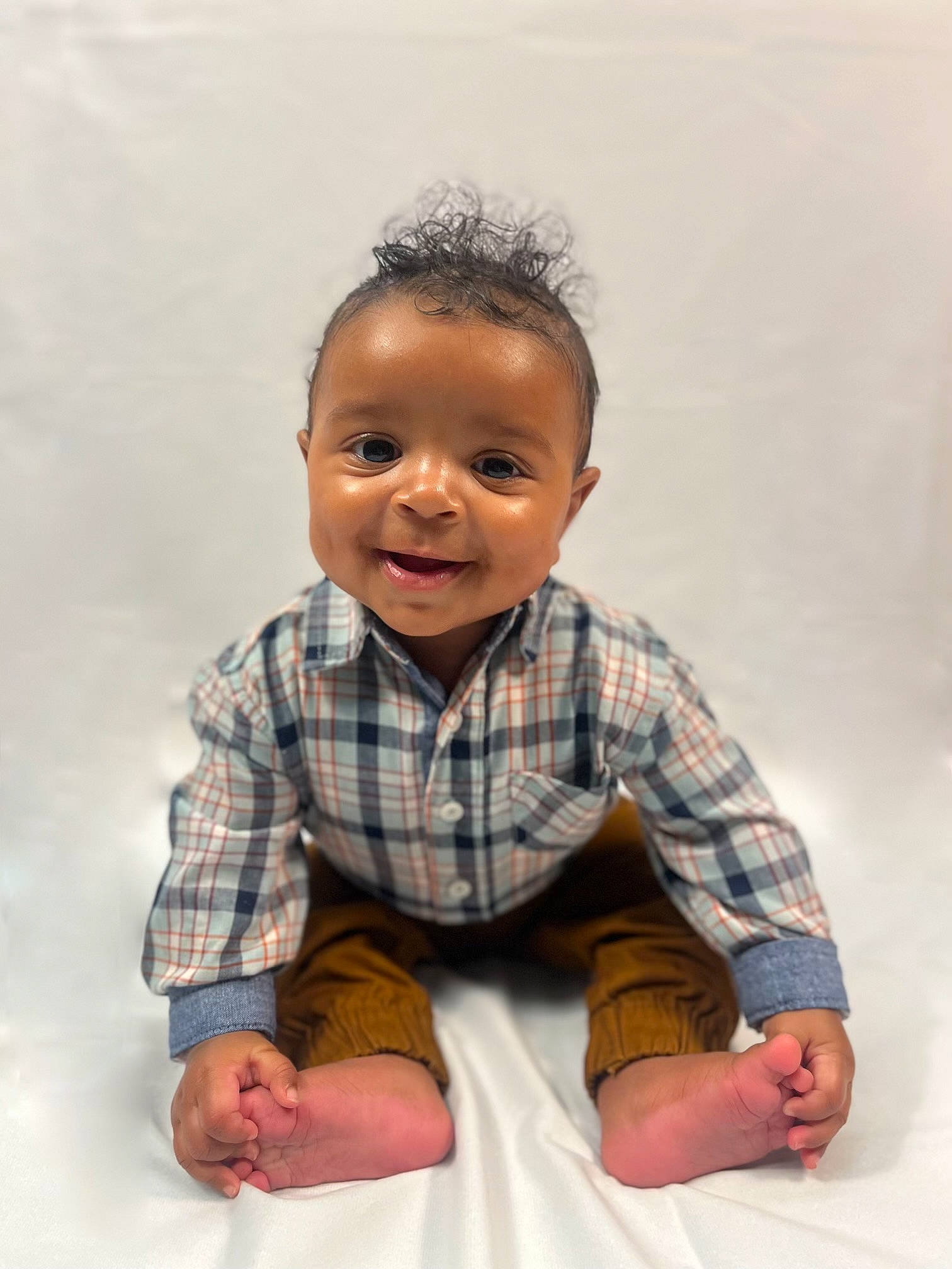Jelani joined the competition — help win amazing prizes! baby_toddler_clothing, barefoot, cheek, child, collar, dress_shirt, elbow, flash_photography, flooring, gesture, happy, human_leg, joy, pattern, person, plaid, sitting, sleeve, smile, t_shirt